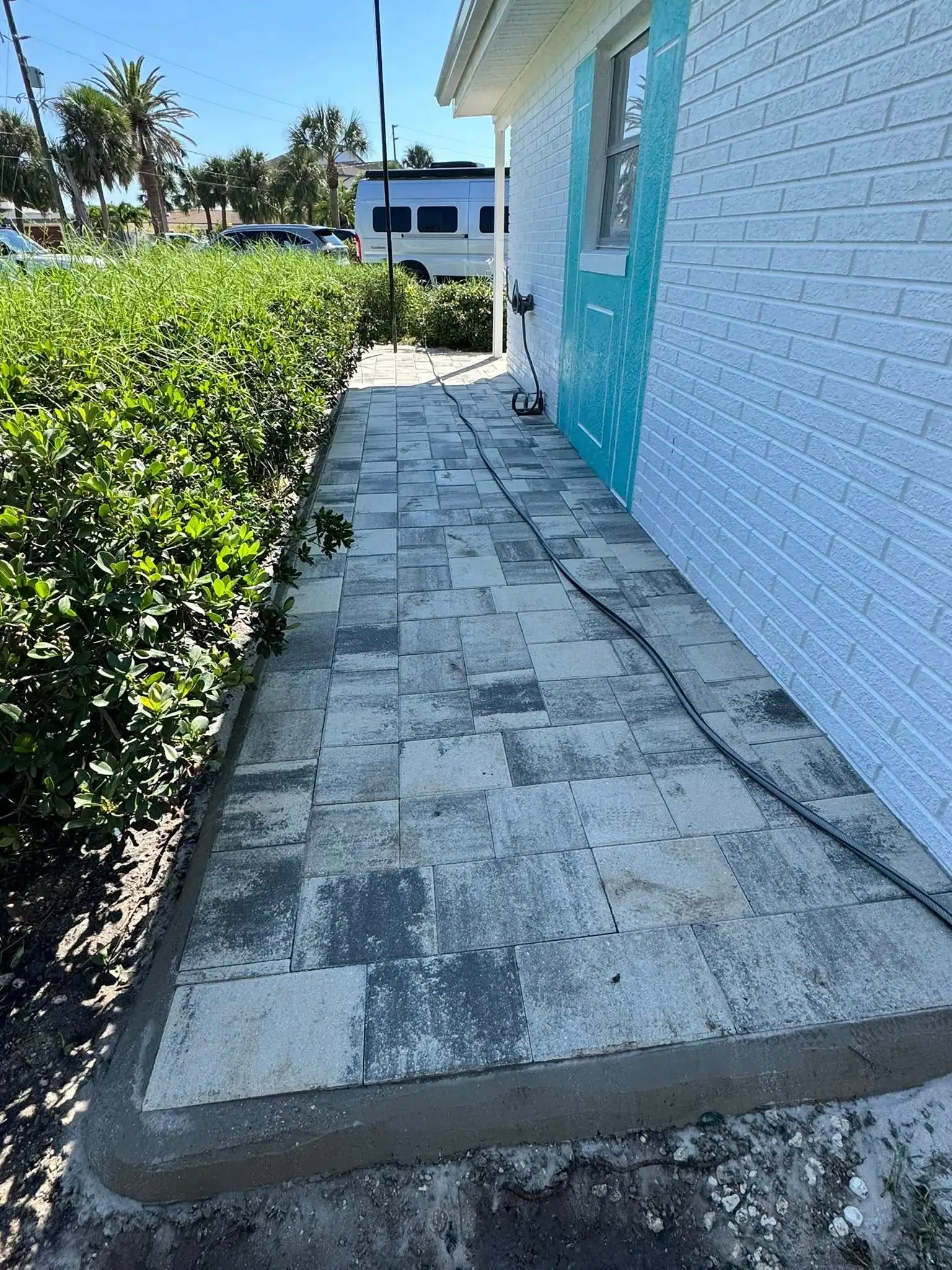 Paver patio and synthetic turf yard